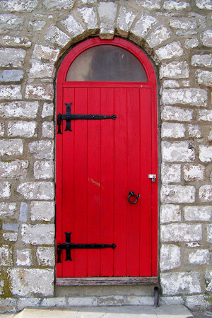Red door into lighthouse