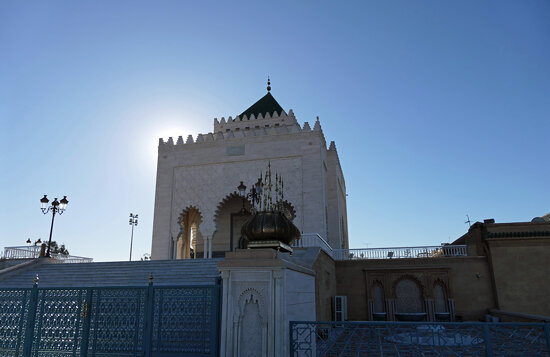 sun behind Mausoleum of Mohammed V