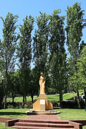 Sculpture of Woman in Trees